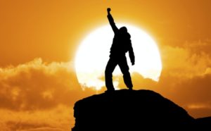 Success-1-300x186 Man on top of mountain