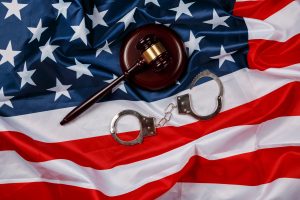 CriminalConviction-300x200 Gavel over american flag