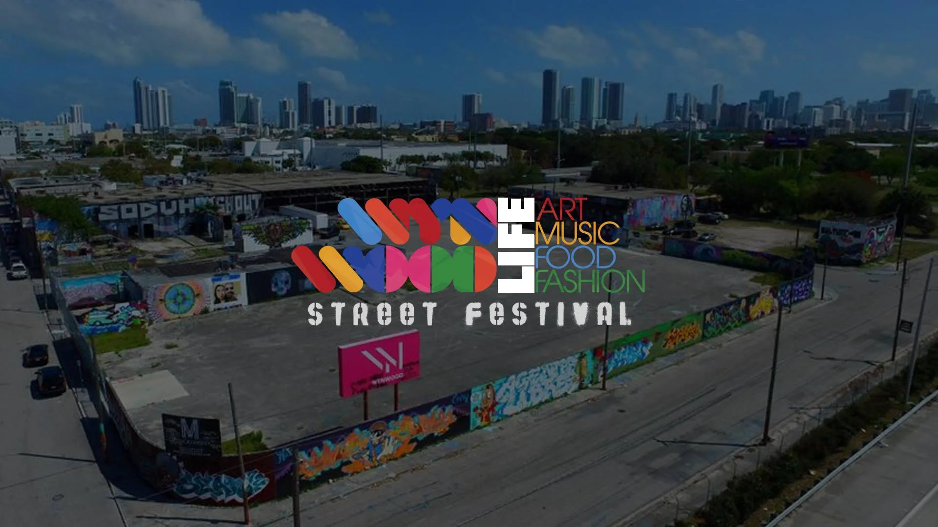 Логотип фестиваля Wynwood Life на фоне панорамы города