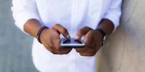 guy-holding-iphone-300x150 guy-holding-iphone