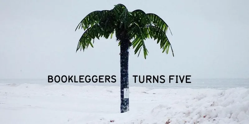 Пальма в снегу у моря с текстом Bookleggers Turns Five.