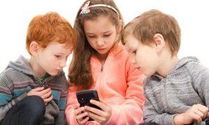 3-children-and-cell-phone-300x179 3-children-and-cell-phone