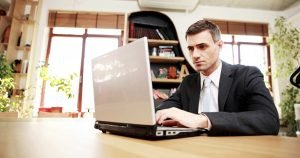 rich-person-on-computer-300x158 rich-person-on-computer