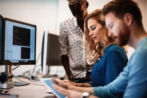 AdobeStock_177093278-300x200 Software engineers working on project and programming in company