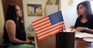 GettyImages-169664412-700x359-300x154 USCIS Processes Immigrant Applications For U.S. Citizenship