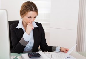 woman-going-through-paperwork-in-office-e1542726108585-300x209 woman-going-through-paperwork-in-office