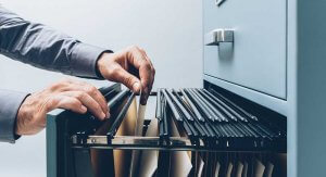 file-being-taken-out-of-filing-cabinet-300x163 file-being-taken-out-of-filing-cabinet