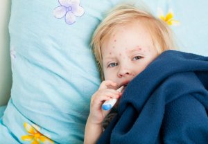 Depositphotos_4999696_m1-300x208 A sick girl is sitting near the bed