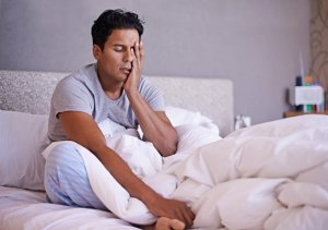 man-waking-up-groggy-in-bed-300x211 man-waking-up-groggy-in-bed