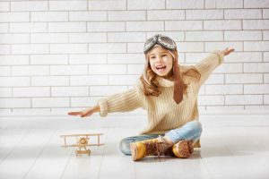DrxtHvHX6s_small-300x200 girl playing with toy airplane