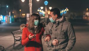 Newshub-300x171 Couple with pollution masks walking at street