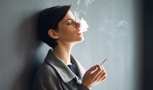 P7G3TWGGSII6RHAPF75PNVBCVI-e1605305388666-300x177 Portrait of fashionable woman smoking a cigarette on dark backgr