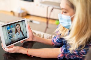 patient-with-mask-using-telemedicine-services-300x200 patient-with-mask-using-telemedicine-services