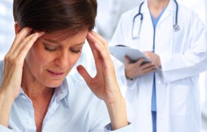 Practical-Pain-Mabagement-300x191 Woman having a migraine headache.