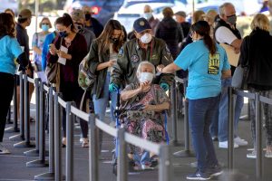 210122-vaccine-line-ew-1227p-300x200 Image: People wait in line to be vaccinated in California