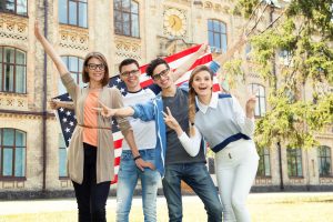 foreign-student-usa-300x200 Group,Of,Students,Holding,Flag,Of,Usa,On,The,University