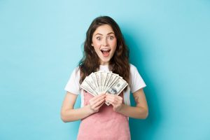 excited-cute-woman-winning-money-holding-dollar-bills-smiling-amazed-got-fast-credit-standing-blue-background-scaled-300x200 Excited cute woman winning money, holding dollar bills and smiling amazed, got fast credit, standing over blue background