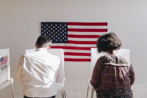 people-voting-election-poll-2022-09-16-07-19-36-utc-wecompress.com_-300x200 American at a polling booth